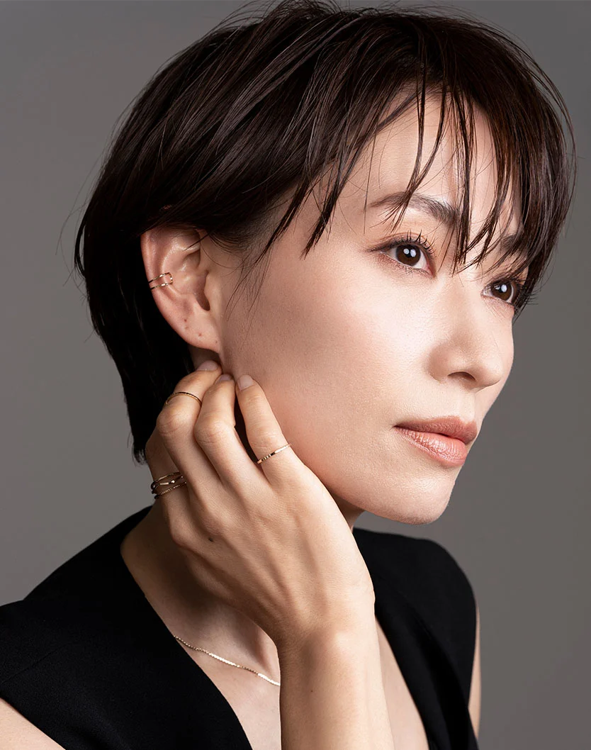 Close-up of a doctor injecting a needle into the forehead/brow area of an older female patient's face as a wrinkle relaxing procedure. - Awake Facelift in San Fransisco, CA